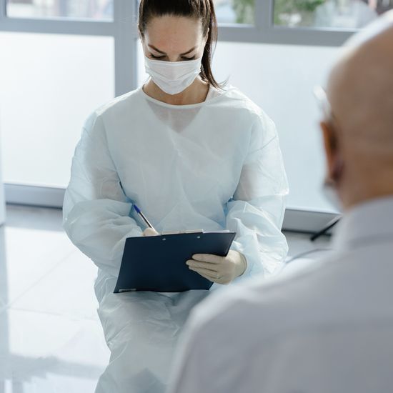 Doctor taking patient notes
